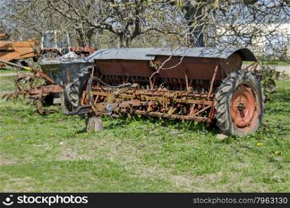 Old abandoned farm machinery, drill, plough, Bulgaria