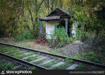 Old abandoned shack stationmaster in the forest
