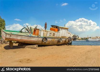 Old abandoned ship on a riverbank of Nile in Luxor. Old abandoned ship