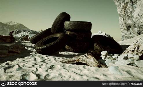 old abandoned tyres on sea shore