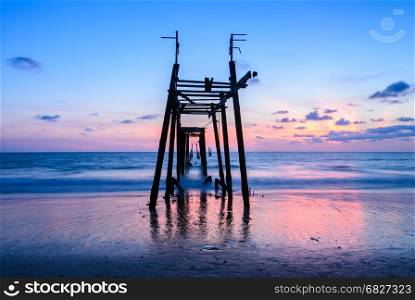 Old abandoned wooden pier with seascape sunset skyline in Phang Nga province, Thailand