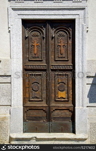 old abstract in venegono italy the old wall and church door