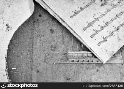 Old acoustic guitar and sheet music