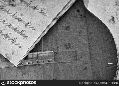 Old acoustic guitar and sheet music