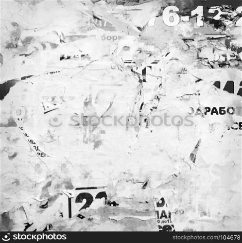 Old advertising wall. Grunge Background from old torn posters on the wall