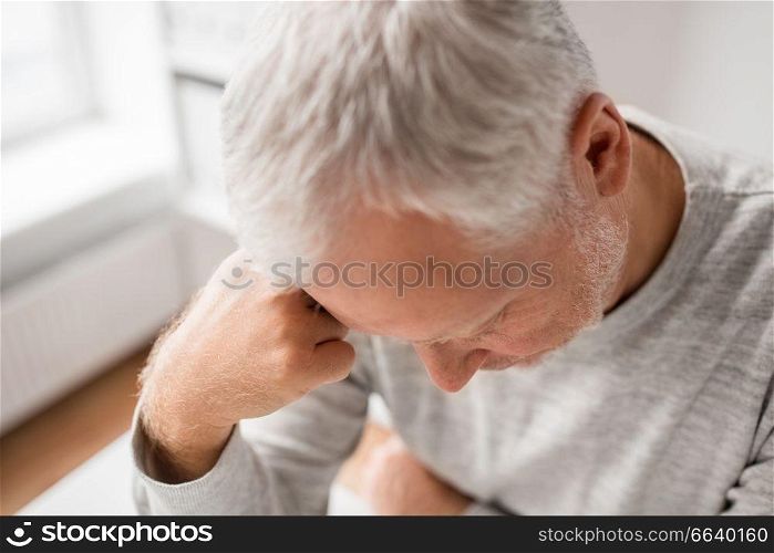 old age, problem and fail concept - close up of sad senior man thinking. close up of sad senior man thinking