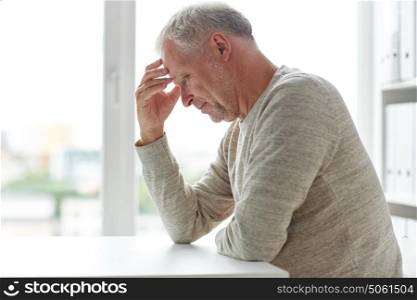 old age, problem and people concept - close up of senior man thinking. close up of senior man thinking