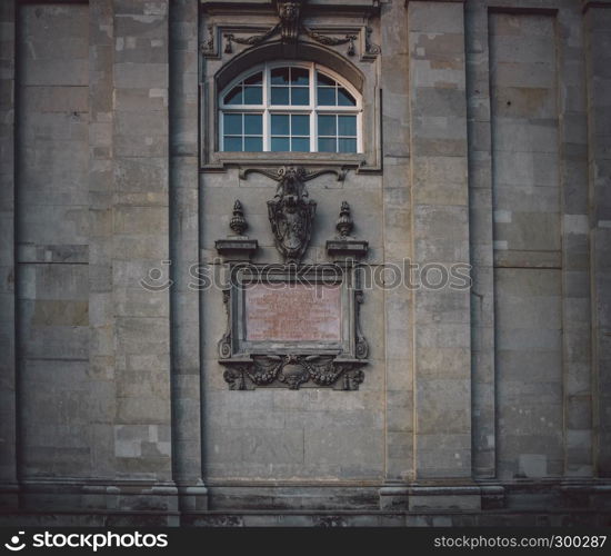 Old aged church facade with old style nameplate