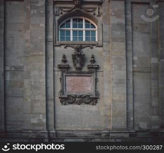 Old aged church facade with old style nameplate