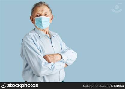 Old aged senior male patient with face mask. Wearing coronavirus covid-19 protection medical mask during the pandemic