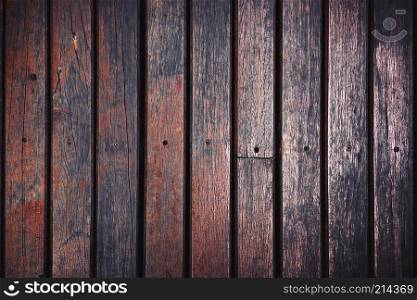 Old aged teak wood background with grunge and dusty textured. Dark brown lath wood panel, floor, wall.