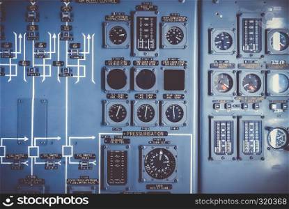 Old airplane control panel in cockpit. Industrial grunge background. Old airplane control panel in cockpit