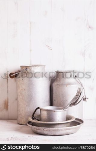 Old aluminium utensils on the shabby chic kitchen