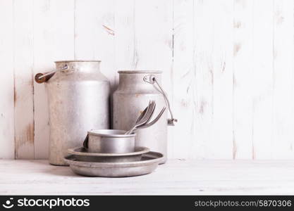 Old aluminium utensils on the shabby chic kitchen