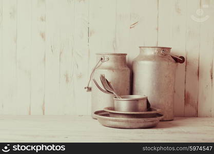 Old aluminium utensils on the shabby chic kitchen. Old aluminium utensils