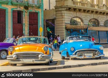 Old american retro cars parked in the center of old Havana, Cuba