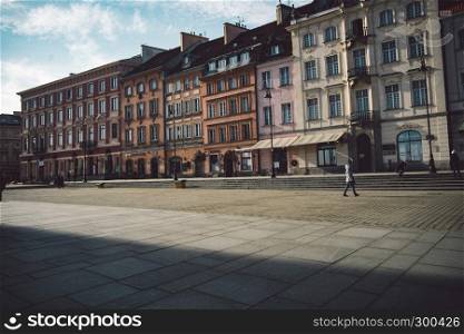 Old ancient polish architecture. Colorful houses as a part of center of the Warsaw. Castle with red bricks