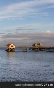 Old and new lifeboat station, The Mumbles, Swansea, Wales, afternoon light, portrait