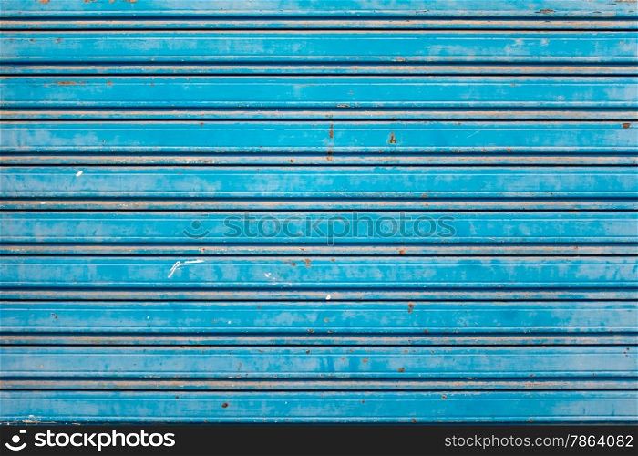 Old and Rusty Blue Roller Security Shutters