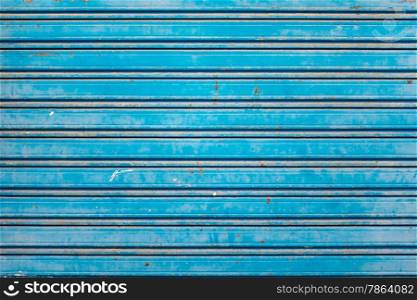 Old and Rusty Blue Roller Security Shutters