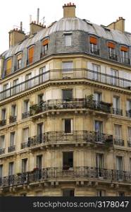 Old apartment buildings with wrought iron balconies in Paris France