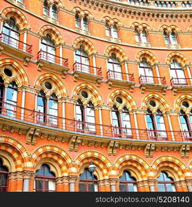 old architecture in london england windows and brick exterior wall