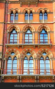 old architecture in london england windows and brick exterior wall