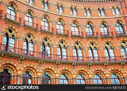 old architecture in london england windows and brick exterior wall