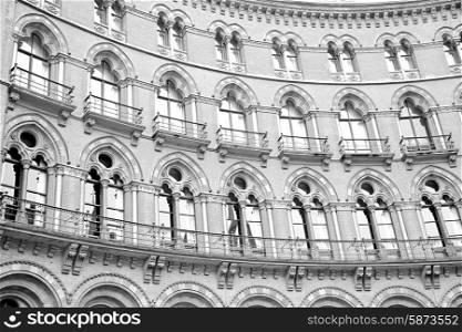 old architecture in london england windows and brick exterior wall