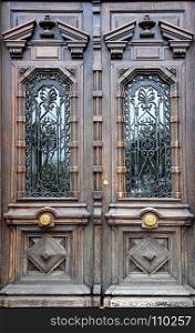 Old artistic wooden door with decorative elements, Cannes, French Riviera