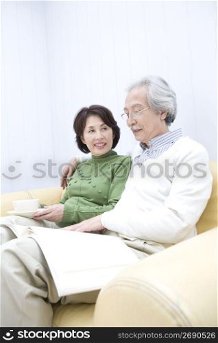 Old asian couple reading