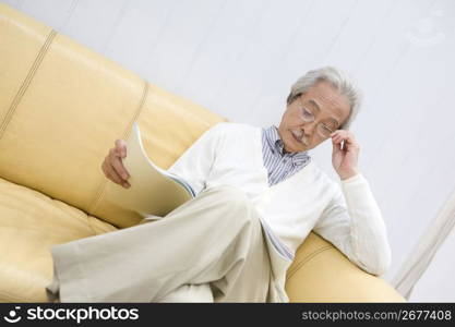 Old asian man reading