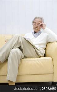 Old asian man reading