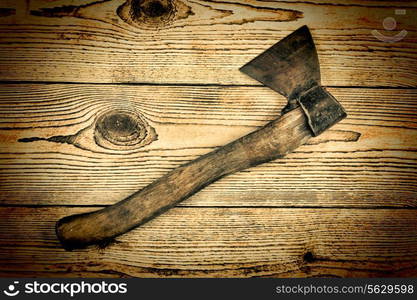 Old Axe on a wooden background. carpentry tools on a wooden background