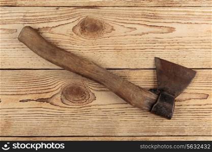 Old Axe on a wooden background. carpentry tools on a wooden background