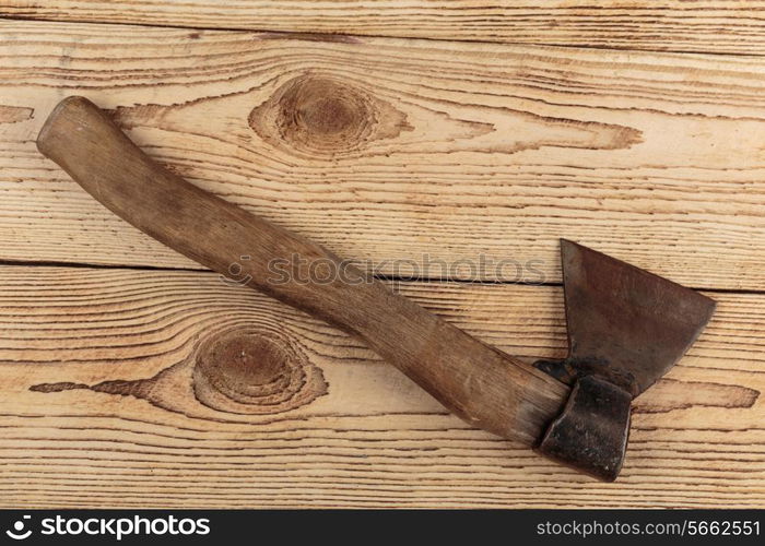 Old Axe on a wooden background. carpentry tools on a wooden background