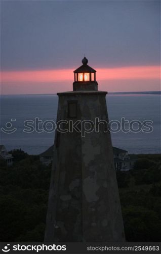 Old Baldy lighthouse at dusk on Bald Head Island, North Carolina.