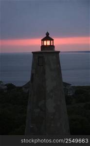 Old Baldy lighthouse at dusk on Bald Head Island, North Carolina.