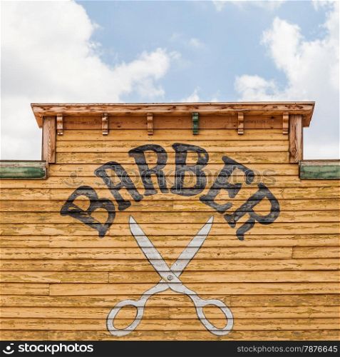 Old barber sign on an abandoned building