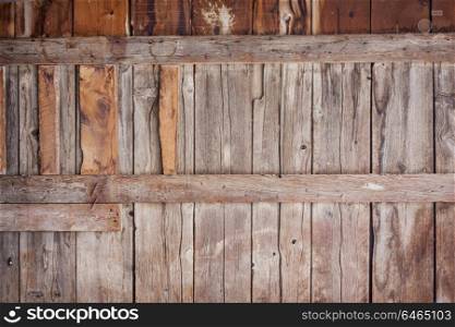 old barn wall with vertical planks - weathered wood background
