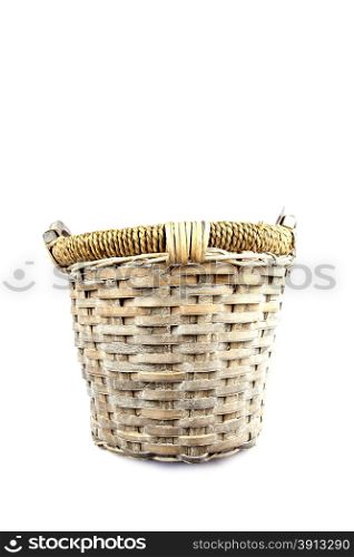 Old basket made of reed isolated on white background
