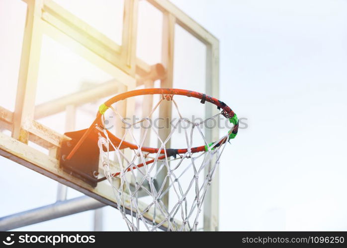 Old basketball hoop with sunlight in the sport outdoor playground public arena street sports concept