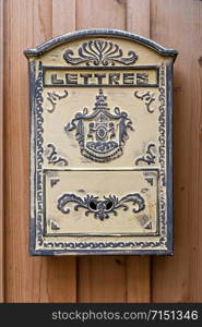 old beautifully decorated post box with the inscription in french language lettres in english letters