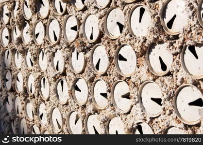 Old beer cans used to build a wall as a background texture