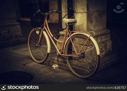 Old bicycle in the city, ecological transport through the city