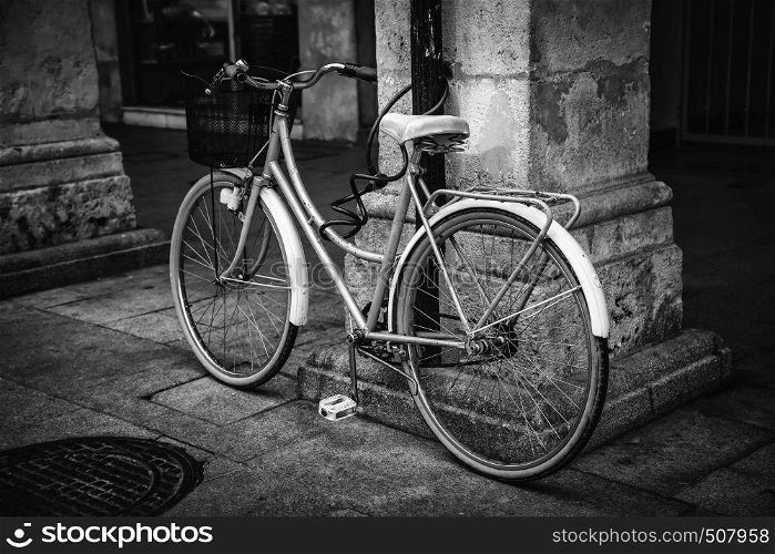 Old bicycle in the city, ecological transport through the city