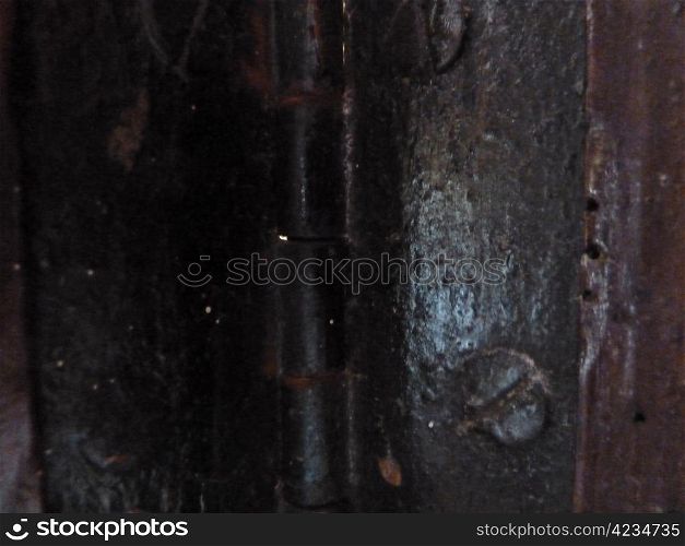 old black metal hinge on a door