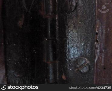 old black metal hinge on a door