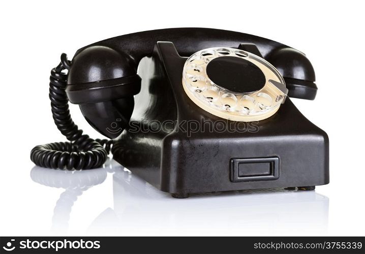 Old black vintage telephone with rotary dial on white background