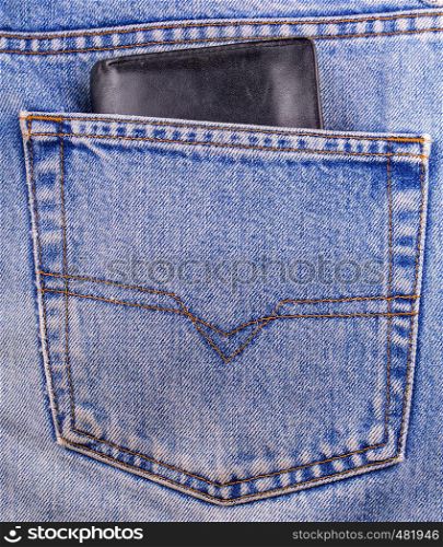 old black Wallet showing in back pocket of jeans